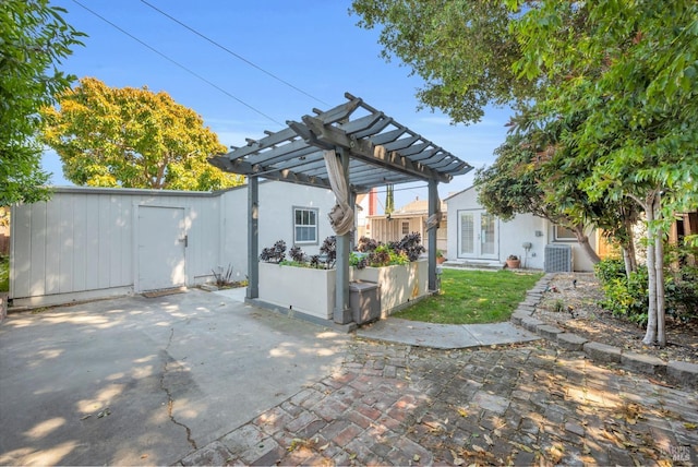 1444 Ohio St, Vallejo, CA 94590 - back of property with a patio area, a pergola, central air condition unit, and an outbuilding