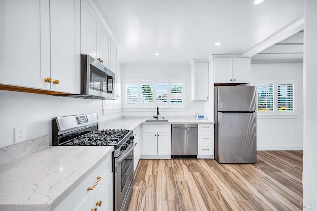 1444 Ohio St, Vallejo, CA 94590 - kitchen featuring stainless steel appliances, a sink, white cabinets, recessed lighting, and light wood-style flooring