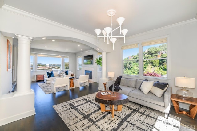 2 Spring Hill Cir, Sausalito, CA 94965 - living room featuring crown molding, decorative columns, healthy amount of natural light, a fireplace, and a chandelier