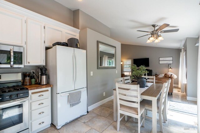 829 Winton Dr, Petaluma, CA 94954 - kitchen featuring appliances with stainless steel finishes, wooden counters, ceiling fan, white cabinets, and baseboards