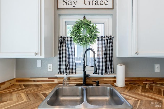 829 Winton Dr, Petaluma, CA 94954 - kitchen view of a sink, white cabinetry, and wooden counters