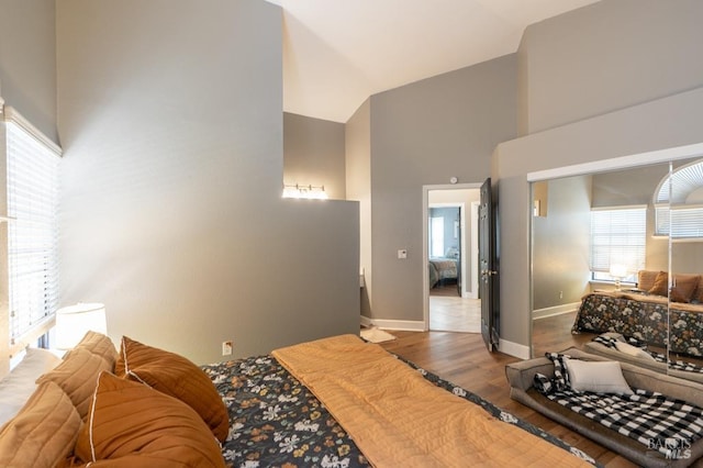 829 Winton Dr, Petaluma, CA 94954 - bedroom featuring a high ceiling, multiple windows, wood finished floors, and baseboards