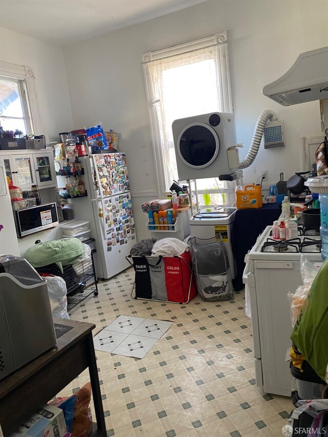 3328 26th St, San Francisco, CA 94110 - kitchen with white appliances and washer / dryer