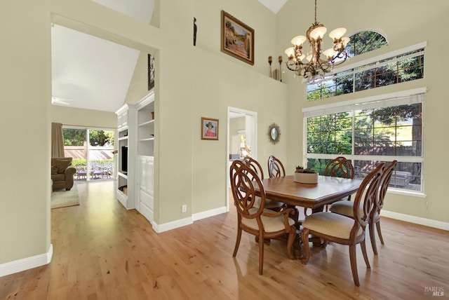 113 Pau Ct, Fairfield, CA 94534 - dining area featuring high vaulted ceiling, baseboards, a chandelier, and light wood-style flooring