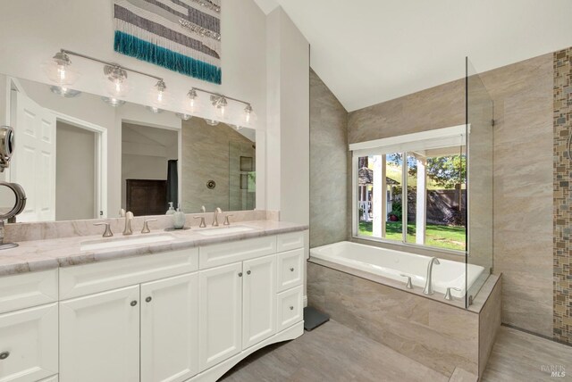 113 Pau Ct, Fairfield, CA 94534 - full bathroom featuring lofted ceiling, a bath, and double vanity