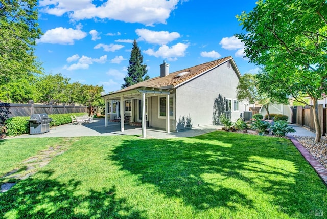 113 Pau Ct, Fairfield, CA 94534 - rear view of property featuring a patio, a chimney, a tiled roof, stucco siding, and central AC
