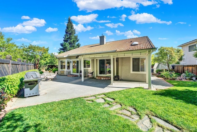 113 Pau Ct, Fairfield, CA 94534 - rear view of house featuring a tile roof, a chimney, stucco siding, and a patio