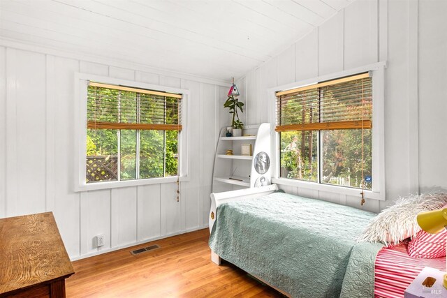 16635 Center Way, Guerneville, CA 95446 - bedroom featuring a decorative wall, wood finished floors, and multiple windows