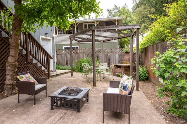 16635 Center Way, Guerneville, CA 95446 - view of patio with stairs, a fenced backyard, outdoor dining space, and an outdoor living space with a fire pit