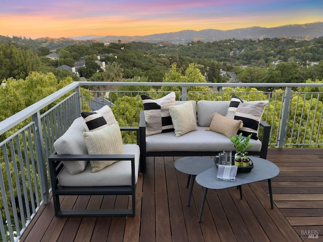 12 Nunes Dr, Novato, CA 94945 - deck at dusk featuring a mountain view, an outdoor living space, and a wooded view