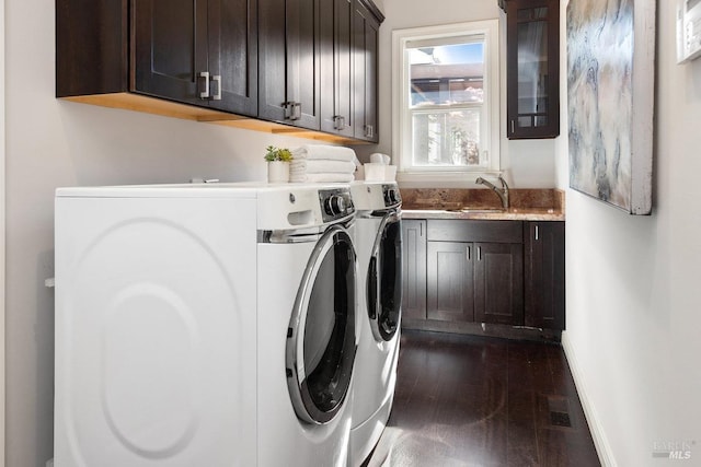12 Nunes Dr, Novato, CA 94945 - clothes washing area with cabinet space, washer and clothes dryer, dark wood-type flooring, and baseboards