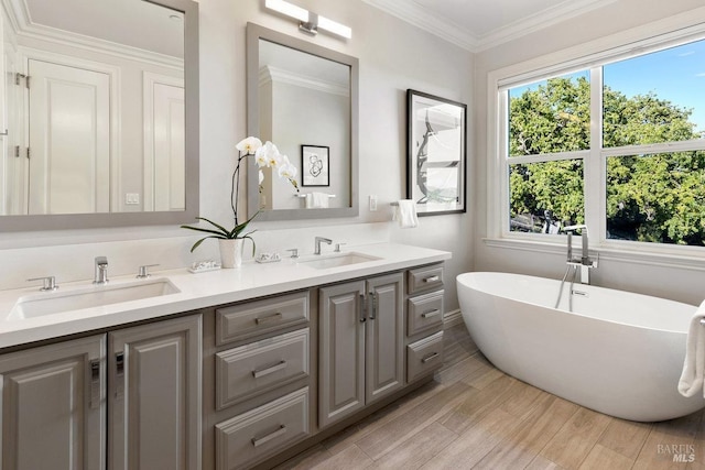 12 Nunes Dr, Novato, CA 94945 - bathroom featuring a freestanding bath, double vanity, wood finished floors, and ornamental molding