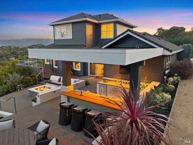 12 Nunes Dr, Novato, CA 94945 - rear view of property featuring a fire pit and a patio