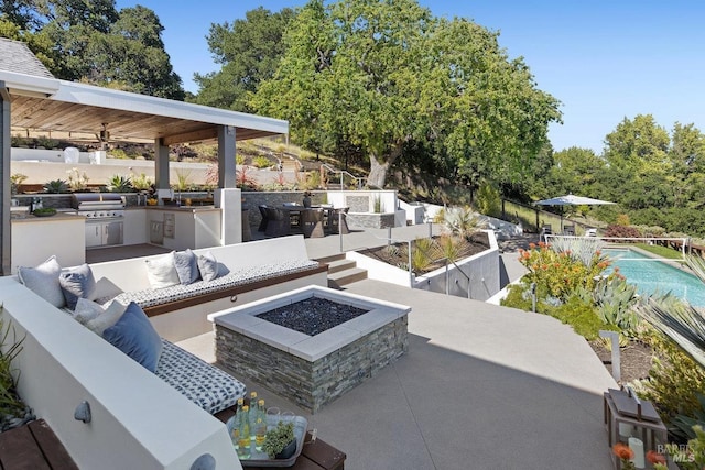 12 Nunes Dr, Novato, CA 94945 - view of patio / terrace with exterior kitchen, an outdoor living space with a fire pit, and a grill