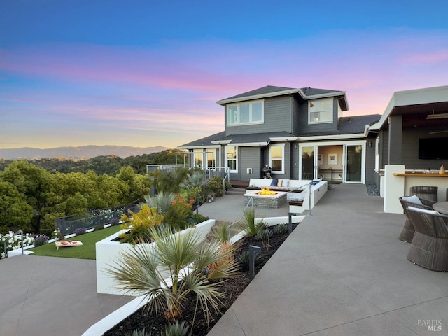 12 Nunes Dr, Novato, CA 94945 - rear view of house featuring an outdoor living space, a patio, exterior kitchen, and a shingled roof