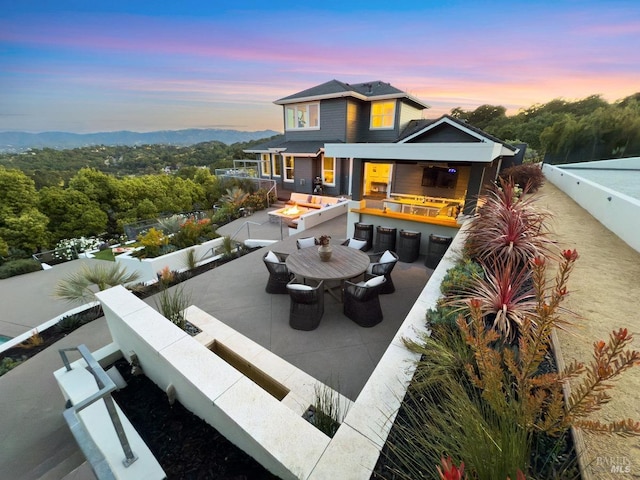 12 Nunes Dr, Novato, CA 94945 - rear view of property with a patio, a fire pit, fence, and outdoor dining space