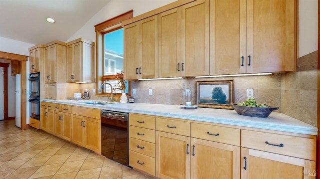 kitchen with black appliances, light brown cabinetry, a sink, light countertops, and backsplash