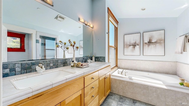 bathroom featuring double vanity and a bath