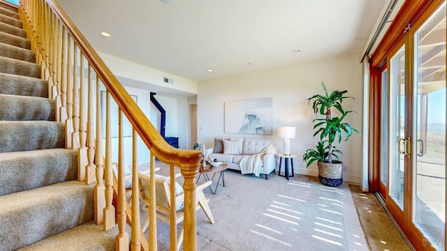 living area with stairway, recessed lighting, baseboards, and carpet floors