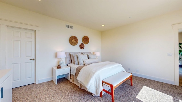 bedroom with baseboards, light carpet, and recessed lighting