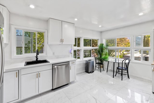 400 Wolfe St, Vallejo, CA 94590 - kitchen with stainless steel dishwasher, a sink, white cabinetry, light countertops, and recessed lighting
