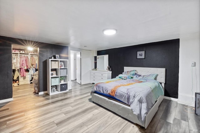 400 Wolfe St, Vallejo, CA 94590 - bedroom featuring wood finished floors, a walk in closet, baseboards, and a closet