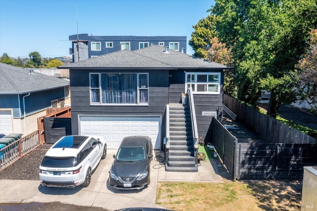 400 Wolfe St, Vallejo, CA 94590 - traditional home featuring concrete driveway, stairway, a garage, fence, and roof with shingles