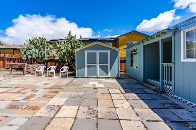 213 Sperry Ave, Vallejo, CA 94590 - view of patio / terrace featuring a storage shed, an outbuilding, a fenced backyard, and outdoor dining area