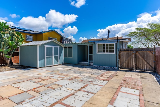 213 Sperry Ave, Vallejo, CA 94590 - rear view of property with a gate, a patio, a shed, and fence