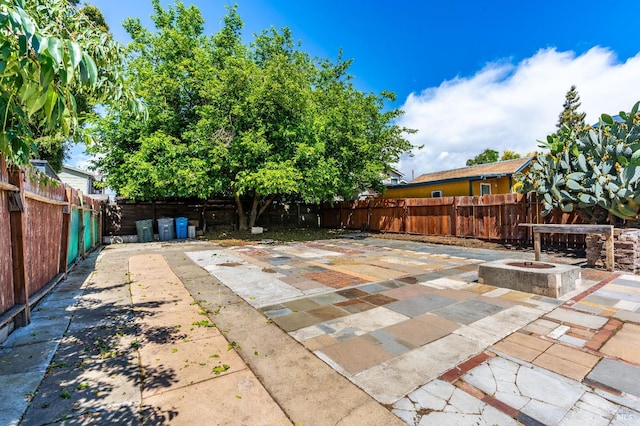 213 Sperry Ave, Vallejo, CA 94590 - view of patio featuring a fenced backyard and an outdoor fire pit