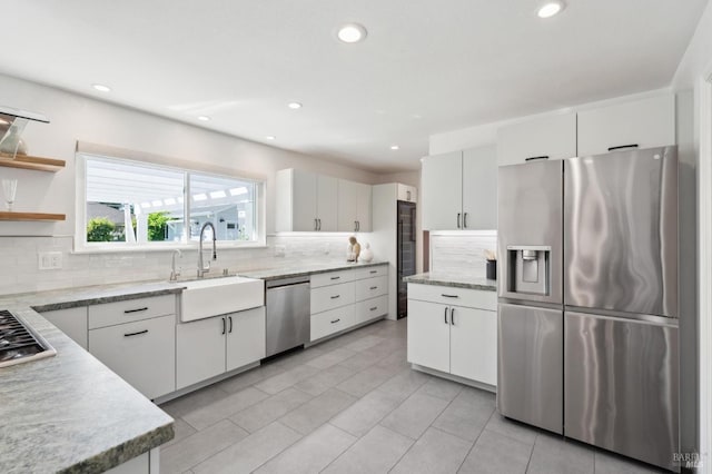 249 Los Palos St, Sonoma, CA 95476 - kitchen with stainless steel appliances, a sink, decorative backsplash, recessed lighting, and white cabinetry