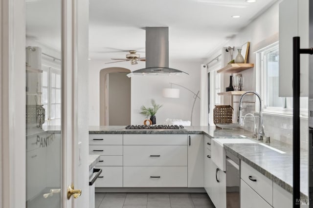 249 Los Palos St, Sonoma, CA 95476 - kitchen featuring island exhaust hood, stainless steel appliances, a sink, open shelves, and light stone counters