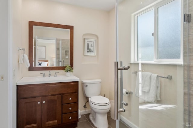 249 Los Palos St, Sonoma, CA 95476 - bathroom featuring toilet, vanity, tile patterned flooring, baseboards, and an enclosed shower