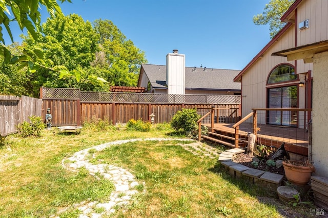 view of yard featuring a wooden deck