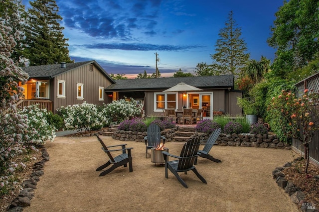 2170 Vineyard Rd, Novato, CA 94947 - back of property with a fire pit, outdoor dining area, and roof with shingles
