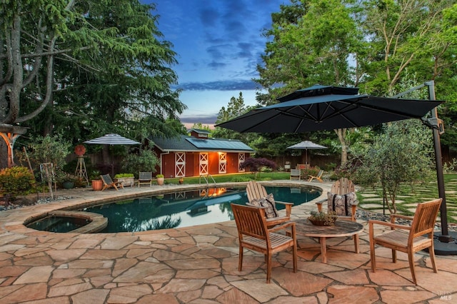 2170 Vineyard Rd, Novato, CA 94947 - pool at dusk with an outbuilding, an in-ground hot tub, an outdoor pool, a patio, and fence