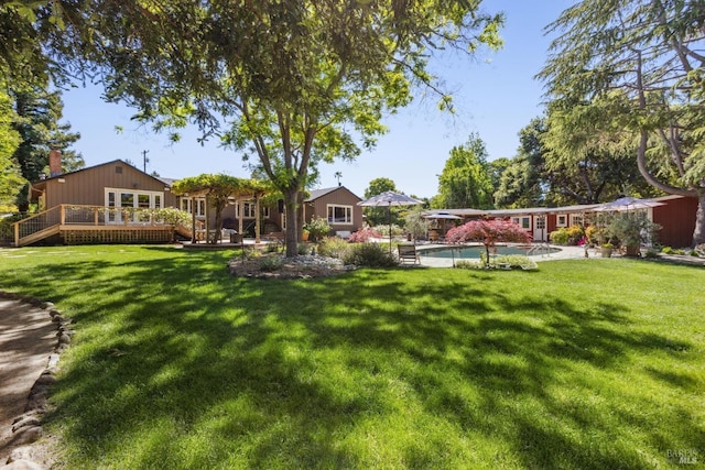 2170 Vineyard Rd, Novato, CA 94947 - view of grassy yard with a wooden deck and an outdoor pool