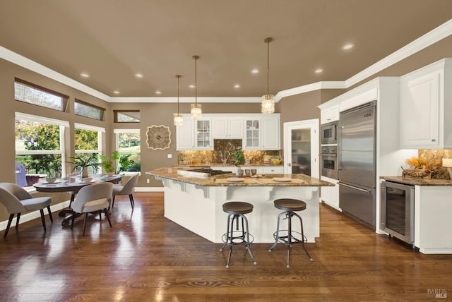 3287 Congressional Ct, Fairfield, CA 94534 - kitchen with built in appliances, wine cooler, glass insert cabinets, a kitchen bar, and tasteful backsplash