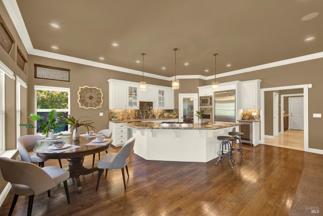 3287 Congressional Ct, Fairfield, CA 94534 - kitchen with built in appliances, dark wood-type flooring, backsplash, a center island, and recessed lighting