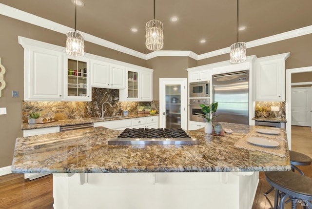 3287 Congressional Ct, Fairfield, CA 94534 - kitchen featuring built in appliances, white cabinetry, wood finished floors, decorative backsplash, and glass insert cabinets