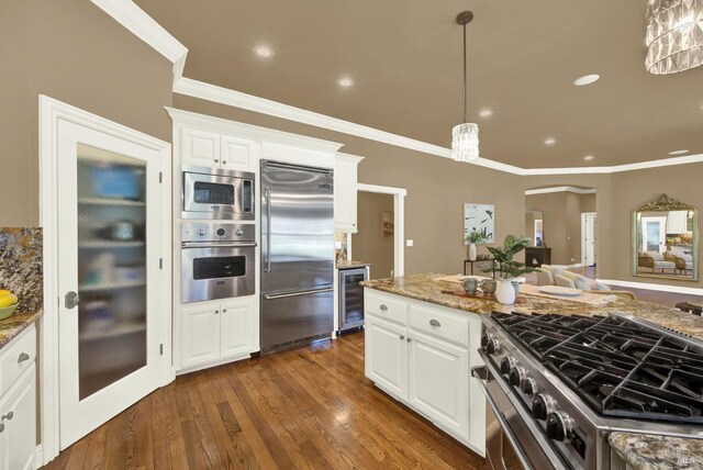 3287 Congressional Ct, Fairfield, CA 94534 - kitchen featuring built in appliances, wine cooler, ornamental molding, white cabinets, and dark wood-style flooring
