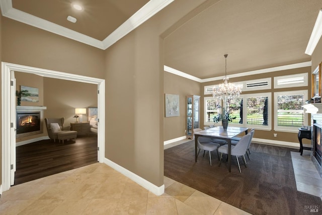 3287 Congressional Ct, Fairfield, CA 94534 - dining room with a glass covered fireplace, baseboards, ornamental molding, and plenty of natural light