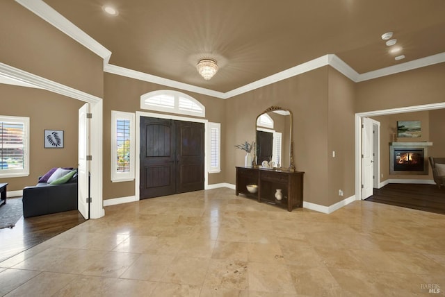 3287 Congressional Ct, Fairfield, CA 94534 - tiled entrance foyer with baseboards, crown molding, arched walkways, a glass covered fireplace, and recessed lighting