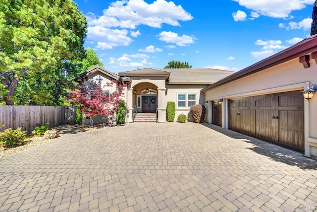 3287 Congressional Ct, Fairfield, CA 94534 - view of front facade featuring decorative driveway, stucco siding, fence, an attached garage, and a tiled roof