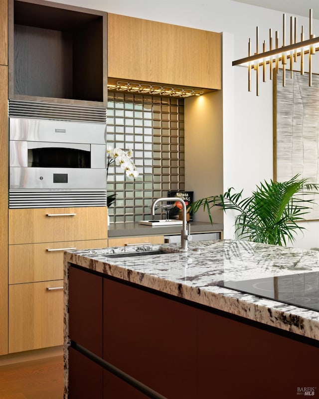2 Upper Alcatraz Pl, Mill Valley, CA 94941 - kitchen featuring light stone countertops, a sink, and modern cabinets