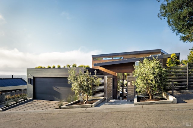 2 Upper Alcatraz Pl, Mill Valley, CA 94941 - contemporary house featuring an attached garage, fence, and concrete driveway