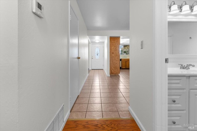 241 Camellia St, Fairfield, CA 94533 - hall with light tile patterned floors, baseboards, and a sink