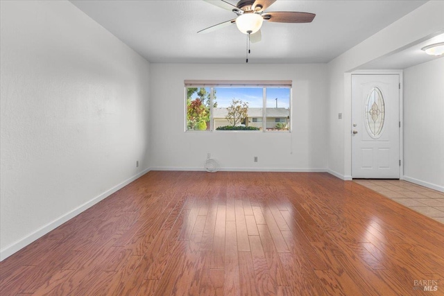 241 Camellia St, Fairfield, CA 94533 - foyer with a ceiling fan, wood finished floors, and baseboards