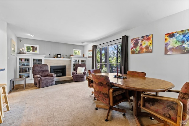 1019 Westside Rd, Healdsburg, CA 95448 - dining area featuring a glass covered fireplace and carpet floors