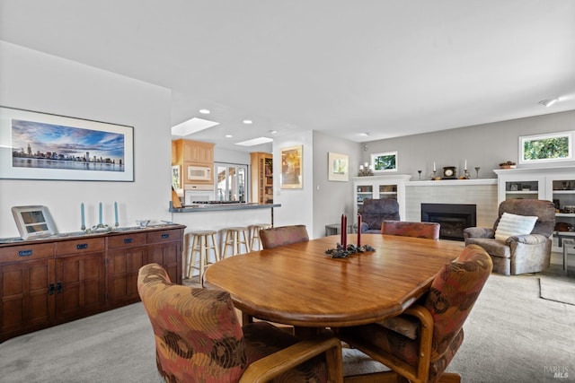 1019 Westside Rd, Healdsburg, CA 95448 - dining area with light carpet, a fireplace, and recessed lighting